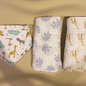 Never worn Set of 2 burp clothes/swaddles w bib